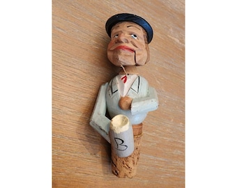 Tappo per bottiglia vintage in legno intagliato a mano con omino meccanico.