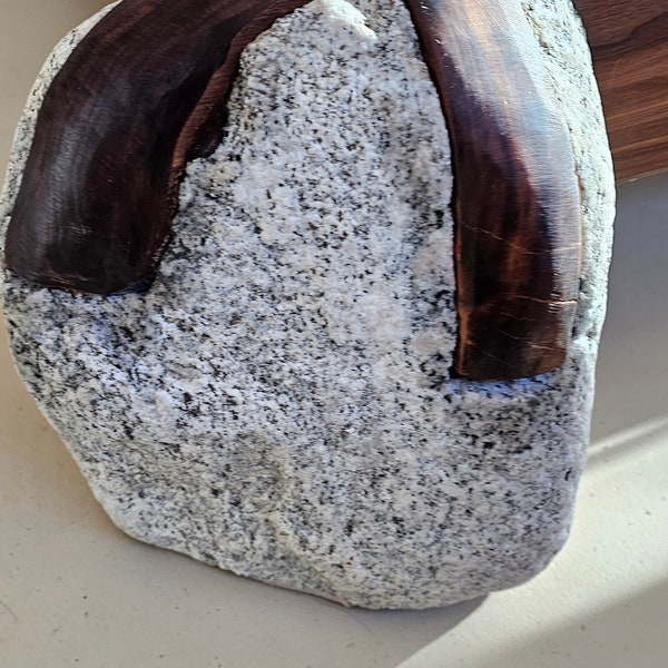 River boulder and walnut bed frame.