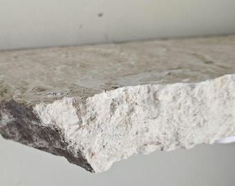 Shell Limestone floating shelf with chiseled edges. natural stone shleves