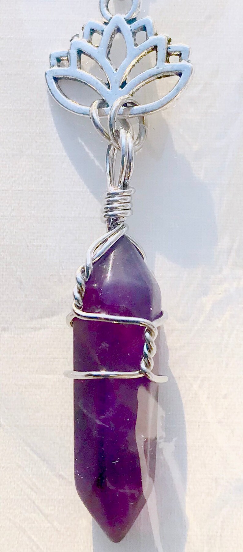 Wire Wrapped Amethyst Crystal Point Necklace with Lotus Symbol 20 Silver Chain.