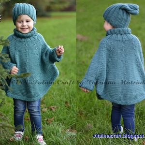 May include: A teal blue knitted poncho and matching hat for a child. The poncho has a turtleneck and long sleeves. The hat has a pointed top.