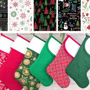 May include: A collection of six Christmas stockings with white cuffs, each featuring a different festive pattern. The patterns include red floral, red quilted, green with gold snowflakes, red plaid, and green quilted designs. The stockings are hanging against a white brick wall.