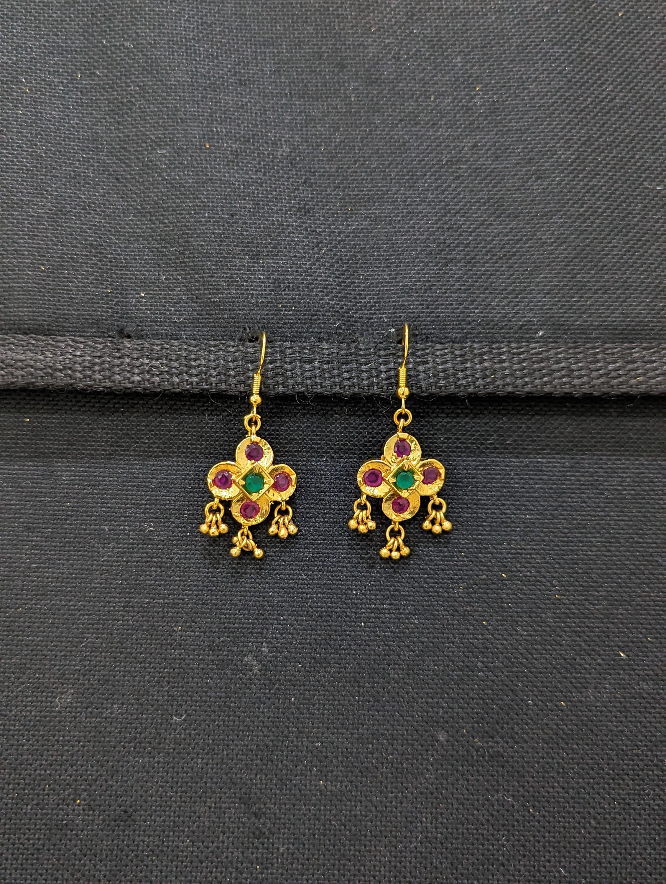Women's Red stone studded gold coloured dangle earring. – Jawaherat