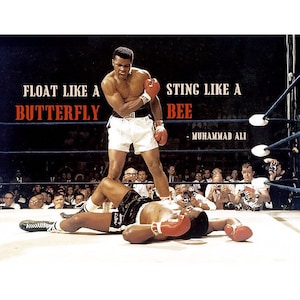 May include: A black and white photo of a boxer standing over a fallen opponent in a boxing ring. The boxer is wearing white boxing shorts and red boxing gloves. The fallen boxer is wearing black boxing shorts and red boxing gloves. The text "FLOAT LIKE A BUTTERFLY STING LIKE A BEE - MUHAMMAD ALI" is printed on the image.