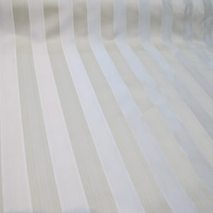 May include: White fabric with beige stripes. The fabric has a subtle sheen and a smooth texture.
