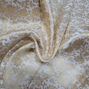 Metallic Brocade Off white   color mix with gold give you a nice combination for interior designing and for Apparel. 45&quot; wide sold by  yard