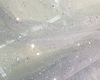 Glitter sparkle tulle usable for apparel accessories interior designs  dancing costumes. 60" wide silve base with silver sparkle  glitters.