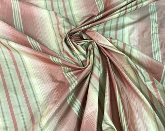 100% Silk Taffetta stripe  fabric by yard  54" wide. Can be used for Clothing and Interior Designing. Combination of Green and pink stripe.