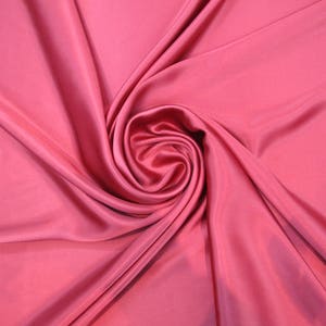 100% Silk Charmeuse Offered in a variety of solid colors, sold by the yard 54 inchs wide.