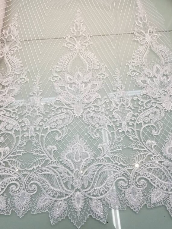 White color cording my lady chantelle French lace designed for apparel accessories and interior designs 52 wide.