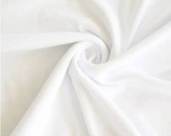 Tela Mikado/Zibelline de poliéster en color blanco. La tela Mikado de 60" de ancho es una mezcla única que hace que esta tela sea suave y le da estructura al vestido.
