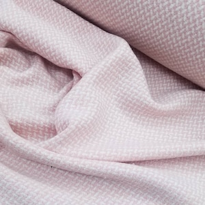 This is a medium  weight wool tweed fabric, as shown in the above pictures. This fabric is suitable for making tailored garments.