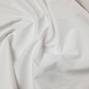 Pure White cotton fabric 110 inches wide usable for Decorations, Wall hanging , floor covering and interior.