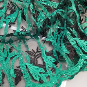 Soft sheer French lace Green  color combined with black for your requirements. Usable for apparel & interior designing.  52 inches wide