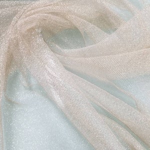Metallic Gold netting soft tulle fabric usable for apparel,accessories and interior designing.  54 inches wide.