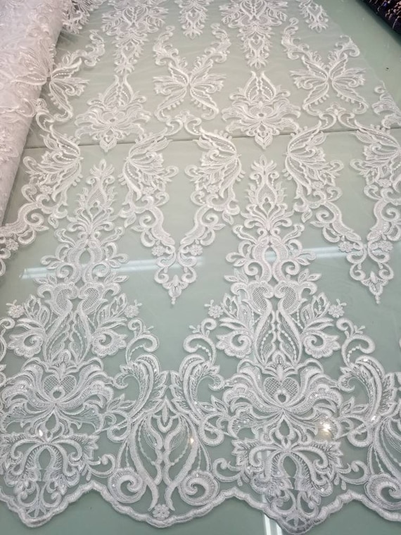 White color cording my lady chantelle French lace designed for apparel accessories and interior designs 52 wide.