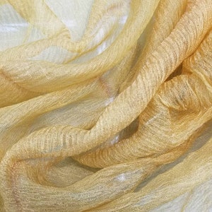 Metallic Dark Gold color krinikled crushed silk organza.  100% Silk Organza. Usable for Apparel and interior designing.