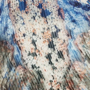 Pleated printed silk chiffon fabric usable for apparel,accessories  and interior designing. Pleated skirts and dress fabric