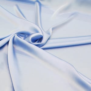 100% Silk Charmeuse Offered in a variety of solid colors, sold by the yard 45 inches wide.