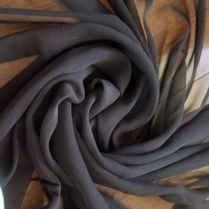 100% Silk georgette black color Chiffon  45&quot; wide. Usable for Apparel accessories and interior designing.