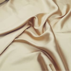 Gold color  Poly Mikado/Zibelline  Fabric. 60&quot; Wide Mikado Fabric is a unique blend makes this fabric soft & Gives Structure to  Dress.