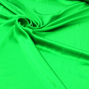 100% Silk Charmeuse Offered in a variety of solid colors, sold by the yard 54 inches wide.