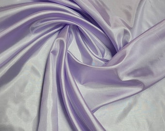 Lilac  color  polyester lining fabric is soft, light weight and has a glossy sheen. China silk polyester lining will for all purposes