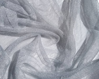 Metallic silver netting soft tulle fabric usable for apparel,accessories and interior designing.  45 inches wide.