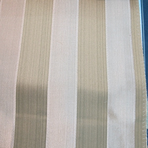 May include: A close-up of a fabric with alternating stripes of beige and white. The fabric has a subtle texture and a woven appearance.