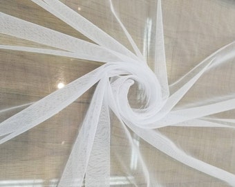 Super fine soft white  color Tulle/Mesh 60" wide sold by the yard usable for Apparel and interior designing.