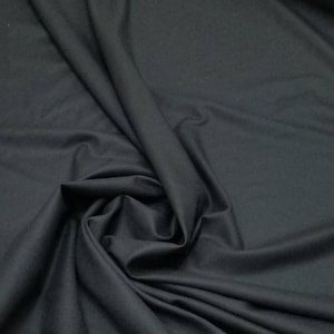 Dark Navy blue wool soft and light weight fabric 56&quot; wide. suitable for apparel and  accessories.  Color is real nice navy blue