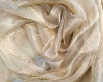 Metallic Gold color  100% Silk Organza 45" wide. Usable for Apparel and interior designing.
