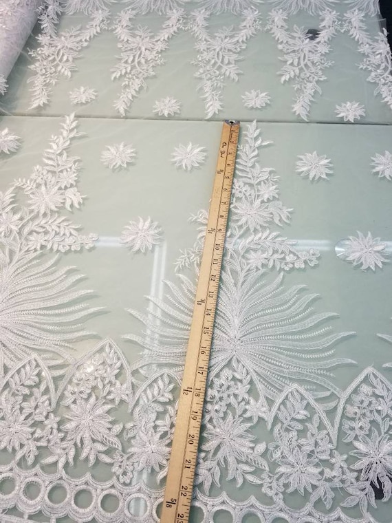 White color cording my lady chantelle French lace designed for apparel accessories and interior designs 52 wide.