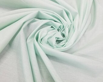 Mint  green  color cotton fabric usable for apparel accessories and interior designs 60" wide. Medium weight quality.
