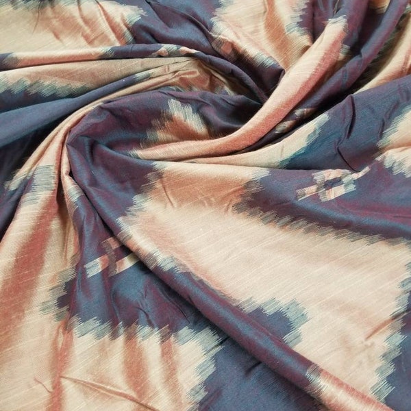 Tie and dye Ikat print sari silk blush mix with brown color fabric. Usable for apparel,accessories and interior designing..