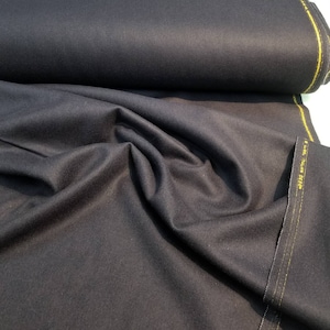 Dark navy blue 100% wool fabric usable for coat, jacket, pants and more. 60&quot; wide soft and drapey fabric.