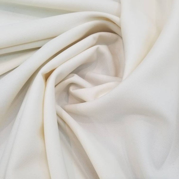 Off white poly wool soft light weight  fabric 60" wide. Suitable for apparel and  accessories. Usable for jacket, skirts and pants.