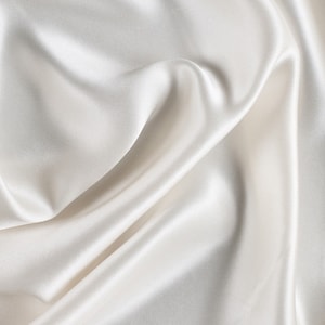 100% Silk Charmuse white  color 54&quot; wide 19mm  usable for apparel accessories and interior designs.