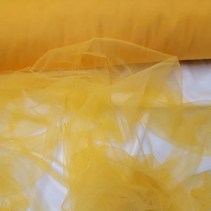 Super fine soft Mustard yellow    color Tulle/Mesh 60" wide sold by the yard usable for Apparel and interior designing.