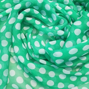 Polka dots 100% Silk chiffon  45&quot; wide. Soft and drapes well.  Usable for Apparel and interior designing. Available in 3 different colors.