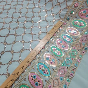 Chiffon metallic sequenced floral  design. Rich and beautiful sequenced silk chiffon to create formal and evening wear.