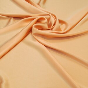 100% Silk Charmeuse Offered in a variety of solid colors, sold by the yard 54 inches wide.