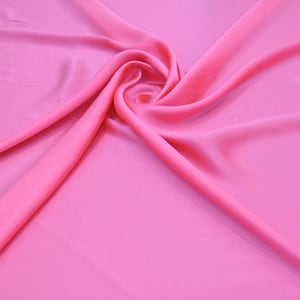 100% Silk Charmeuse Offered in a variety of solid colors, sold by the yard 54 inches wide.