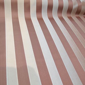 May include: A fabric with alternating stripes of brown and white. The fabric has a subtle sheen and a smooth texture.