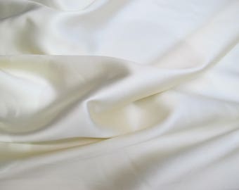 Ivory  Poly Mikado/Zibelline  Fabric. 60" Wide Mikado Fabric is a unique blend makes this fabric soft & Gives Structure to  Dress.