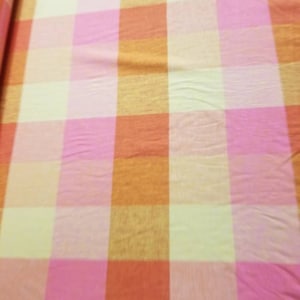 Linen plaid  54 inches wide. Usable for household furnishing and clothing.