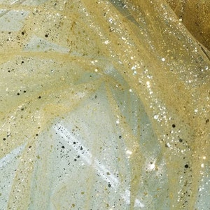 Yellow Gold Glitter sparkle tulle usable for apparel accessories interior designs   costumes. 60&quot; yellow Gold base Gold  sparkle  glitters.