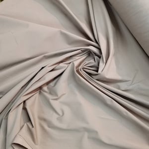 Khaki Beige color heavy stretch cotton fabric. Usable for apparel,accessories  and interior designing.