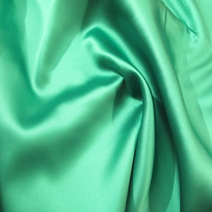 Green  Mikado/Zibelline  Fabric. 60&quot; Wide Mikado Fabric is a unique blend makes this fabric soft & Gives Structure to  Dress.