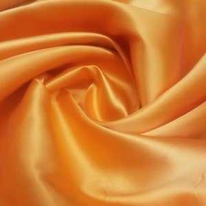 Orange   Mikado/Zibelline  Fabric. 60&quot; Wide Mikado Fabric is a unique blend makes this fabric soft & Gives Structure to  Dress.